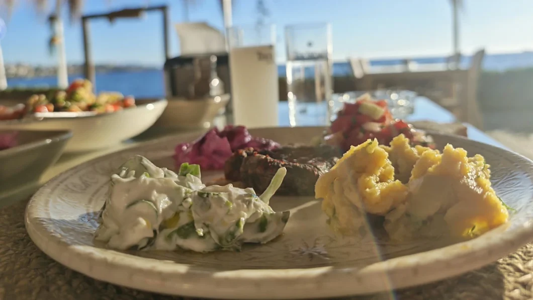 Assorted Turkish meze served on a plate at a seaside restaurant