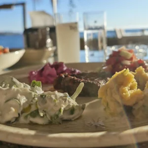 Assorted Turkish meze served on a plate at a seaside restaurant