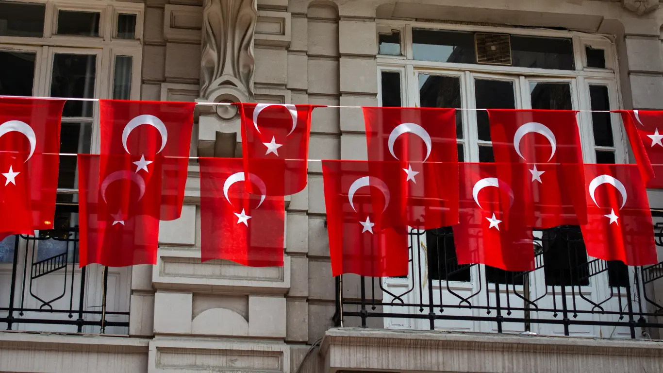 Turkish flags displayed on a building for a national holiday in Turkey